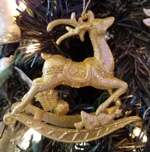 Gold reindeer ornament with glitter